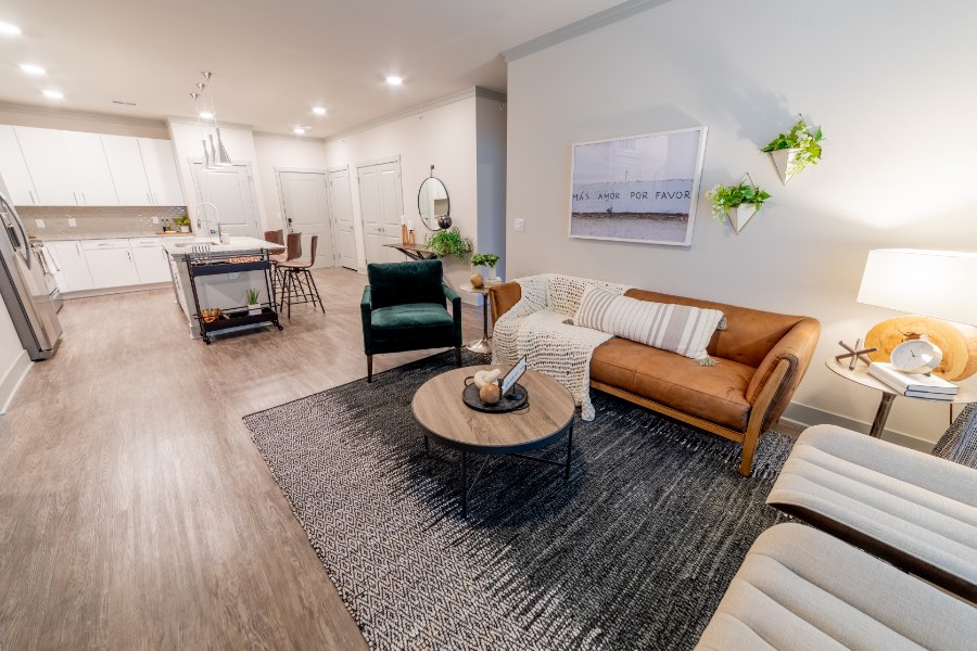 Consider your budget before viewing apartments like this beautiful unit at Verge Luxury Flats. Open apartment floor plan with connected kitchen and living room.